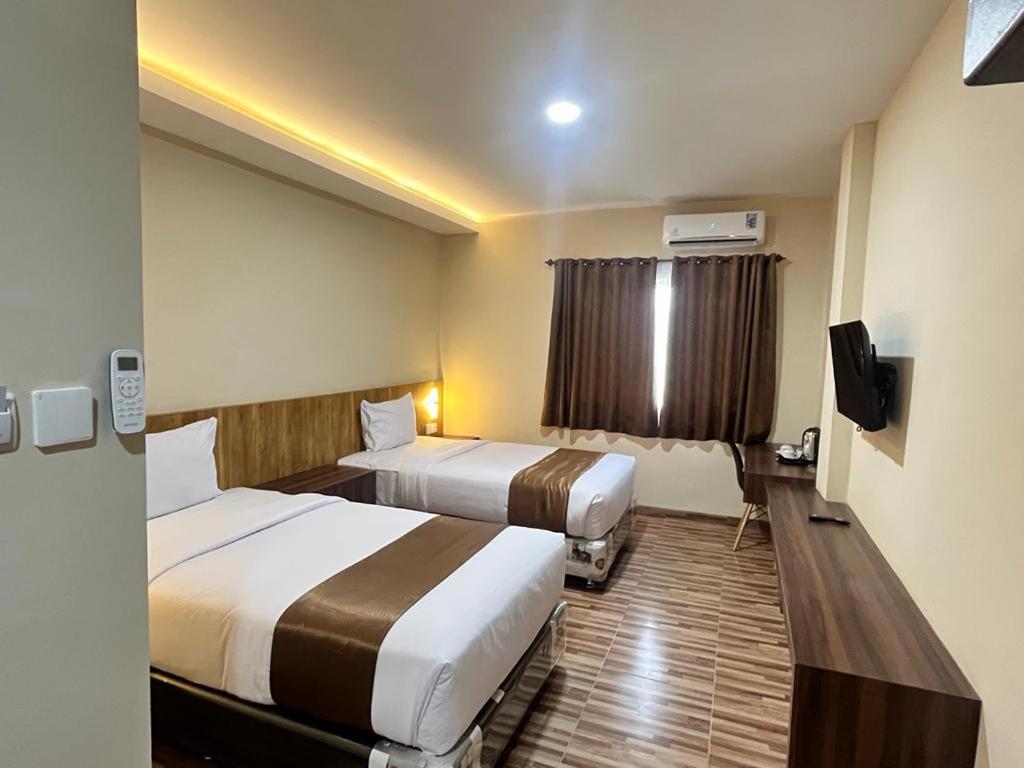 T Hotel Kualanamu Lubukpakam Buitenkant foto